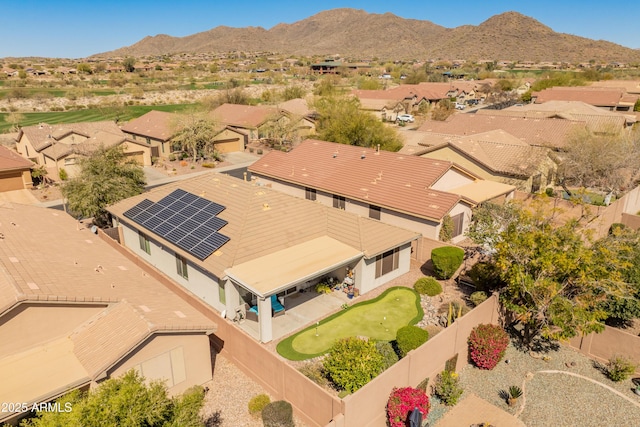 birds eye view of property with a mountain view and a residential view