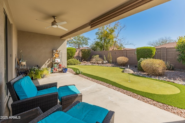 view of patio / terrace with a ceiling fan and a fenced backyard