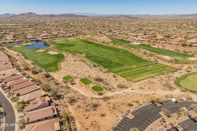 bird's eye view with golf course view and a water and mountain view