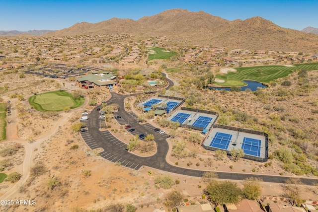 birds eye view of property with a mountain view and golf course view