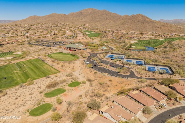 bird's eye view with a mountain view and view of golf course