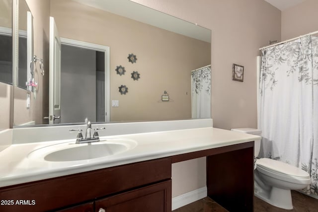 bathroom with toilet and vanity