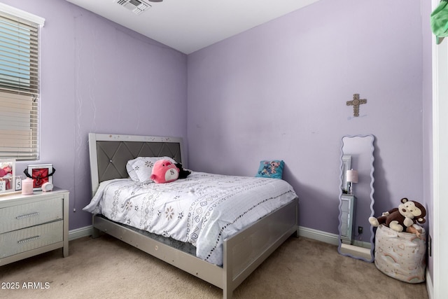 bedroom with baseboards, visible vents, and carpet