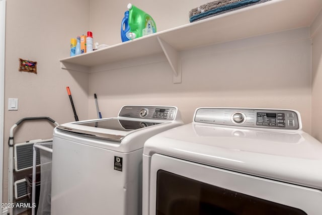 laundry room featuring independent washer and dryer and laundry area