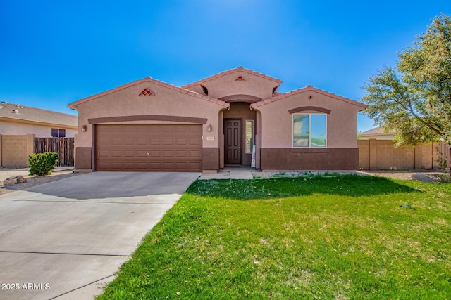 mediterranean / spanish house with driveway, stucco siding, fence, and a garage