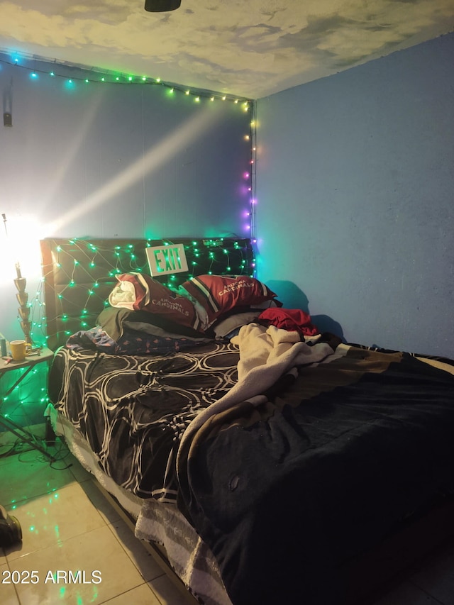 bedroom featuring tile patterned flooring