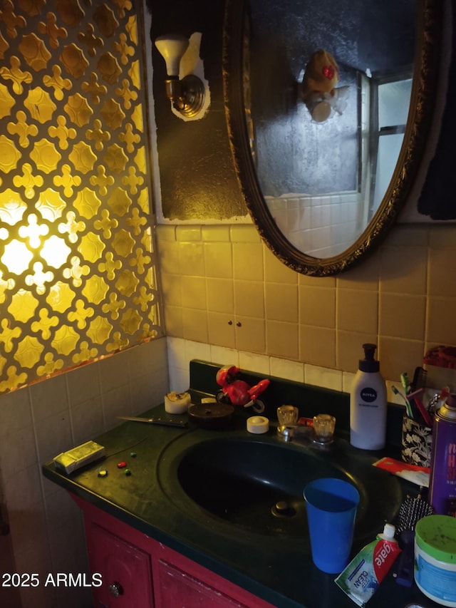 bathroom featuring tile walls, vanity, and backsplash