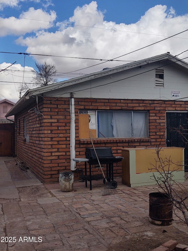 back of house with a patio area