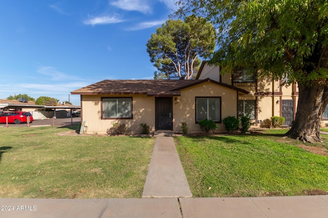 6120 N 30th Ave, Phoenix, AZ 85017 - view of front facade with a front yard and a carport