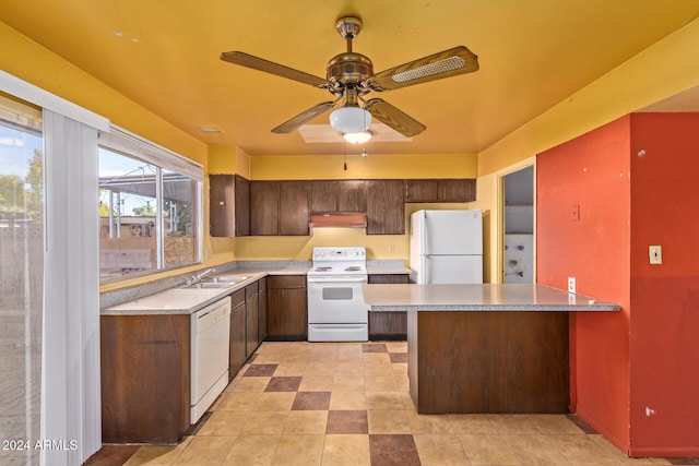6120 N 30th Ave, Phoenix, AZ 85017 - kitchen with white appliances, a sink, under cabinet range hood, and light countertops