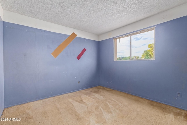 6120 N 30th Ave, Phoenix, AZ 85017 - carpeted spare room with a textured ceiling