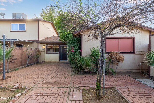 6120 N 30th Ave, Phoenix, AZ 85017 - rear view of house featuring a patio area, fence, central AC, and stucco siding