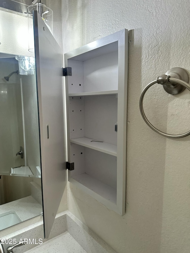 6120 N 30th Ave, Phoenix, AZ 85017 - bathroom featuring a shower and a textured wall