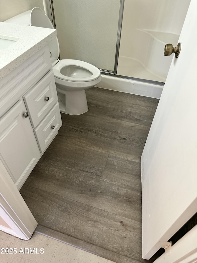 6120 N 30th Ave, Phoenix, AZ 85017 - bathroom featuring a shower stall, vanity, toilet, and wood finished floors
