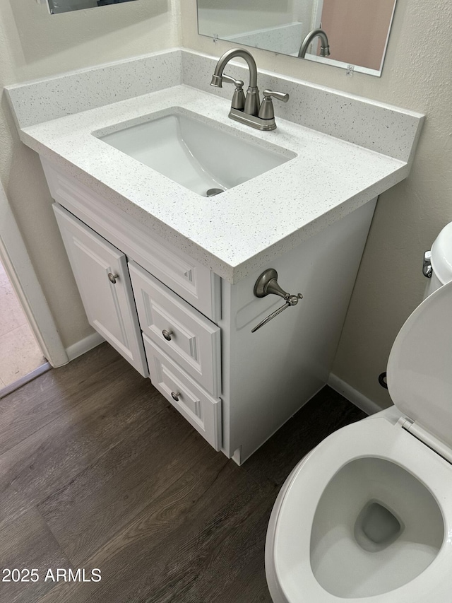 6120 N 30th Ave, Phoenix, AZ 85017 - half bath with toilet, wood finished floors, and vanity