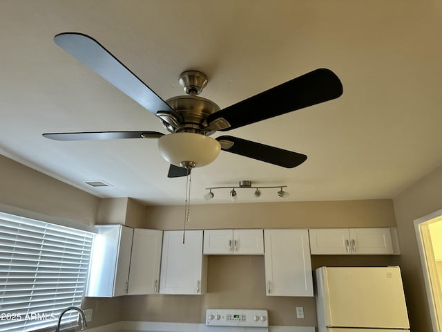 6120 N 30th Ave, Phoenix, AZ 85017 - detailed view of freestanding refrigerator, stove, and a ceiling fan