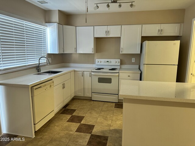 6120 N 30th Ave, Phoenix, AZ 85017 - kitchen with white appliances, a sink, and white cabinetry