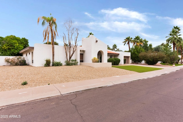 8411 E Via De Jardin, Scottsdale, AZ 85258 - view of front of home featuring stucco siding, driveway, and an attached garage