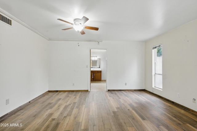 8411 E Via De Jardin, Scottsdale, AZ 85258 - unfurnished room featuring light wood finished floors and a ceiling fan