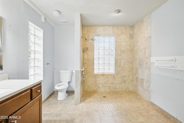 8411 E Via De Jardin, Scottsdale, AZ 85258 - full bathroom featuring vanity, a tile shower, and tile patterned flooring