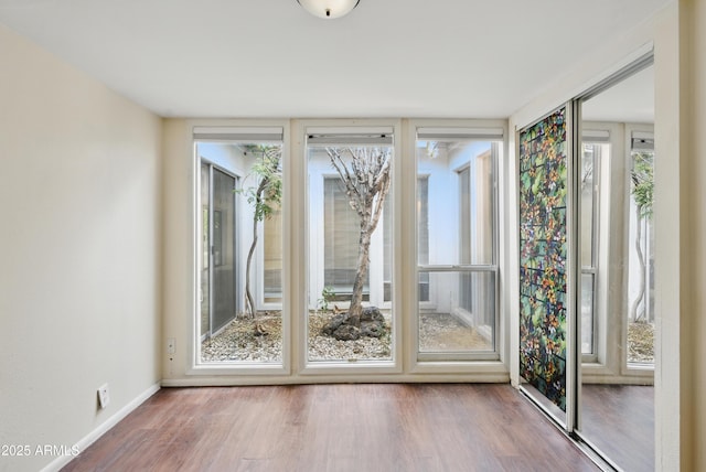 8411 E Via De Jardin, Scottsdale, AZ 85258 - doorway featuring wood finished floors and plenty of natural light