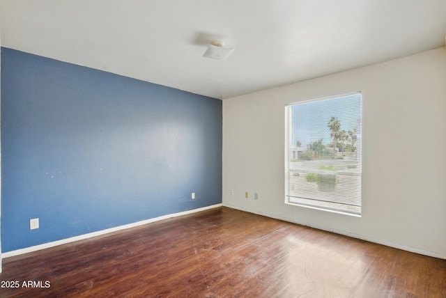 8411 E Via De Jardin, Scottsdale, AZ 85258 - spare room with wood finished floors and baseboards