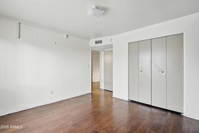 8411 E Via De Jardin, Scottsdale, AZ 85258 - unfurnished bedroom featuring wood finished floors and a closet
