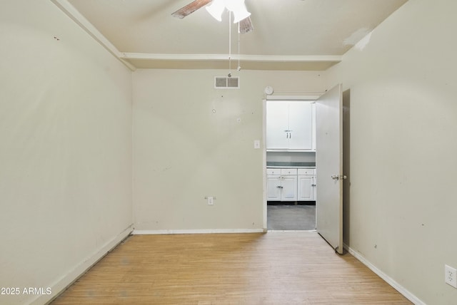8411 E Via De Jardin, Scottsdale, AZ 85258 - empty room featuring light wood-style flooring and ceiling fan