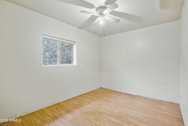 8411 E Via De Jardin, Scottsdale, AZ 85258 - empty room featuring light wood-style flooring and ceiling fan