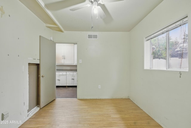 8411 E Via De Jardin, Scottsdale, AZ 85258 - empty room featuring ceiling fan and light wood-type flooring