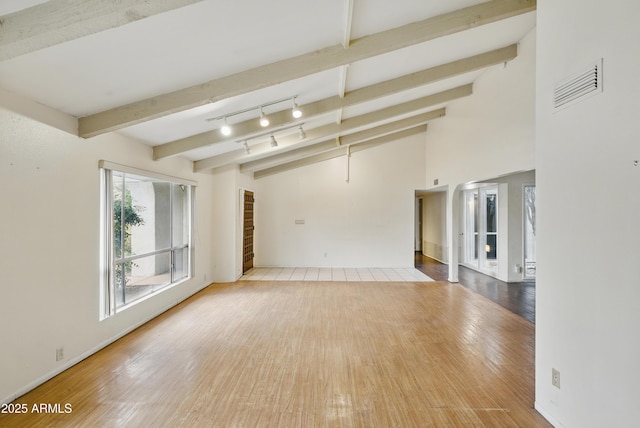 8411 E Via De Jardin, Scottsdale, AZ 85258 - unfurnished room with wood finished floors and beam ceiling