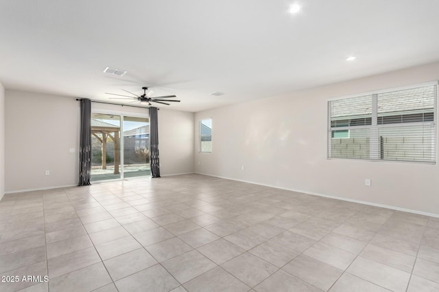 empty room with recessed lighting, visible vents, ceiling fan, and baseboards