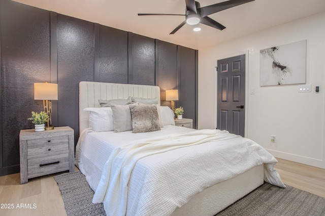 bedroom featuring ceiling fan and light wood-type flooring