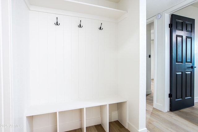 mudroom with light hardwood / wood-style floors