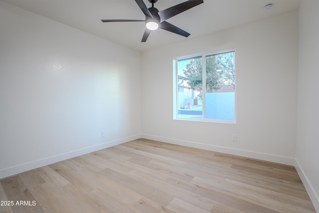 empty room featuring ceiling fan and light wood-type flooring