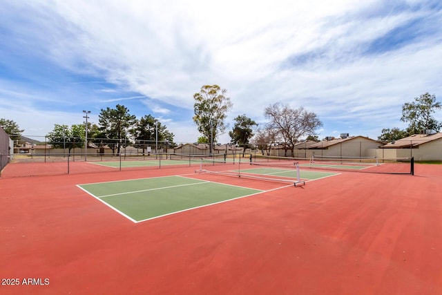 view of tennis court featuring basketball court