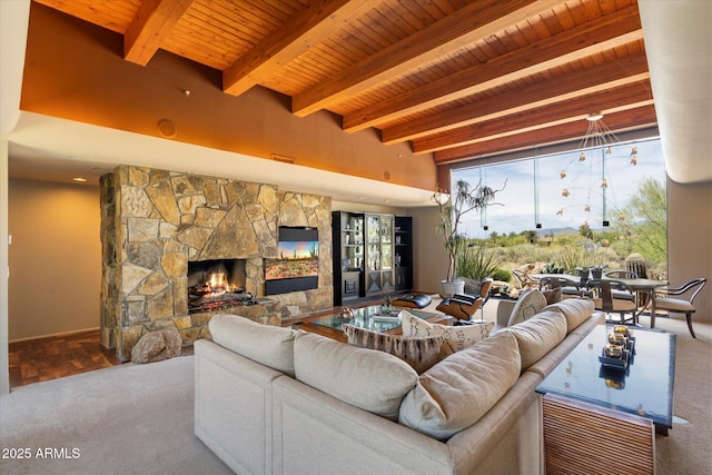 3120 Arroyo Hondo, Carefree, AZ 85377 - living area featuring carpet flooring, a fireplace, beam ceiling, and wood ceiling
