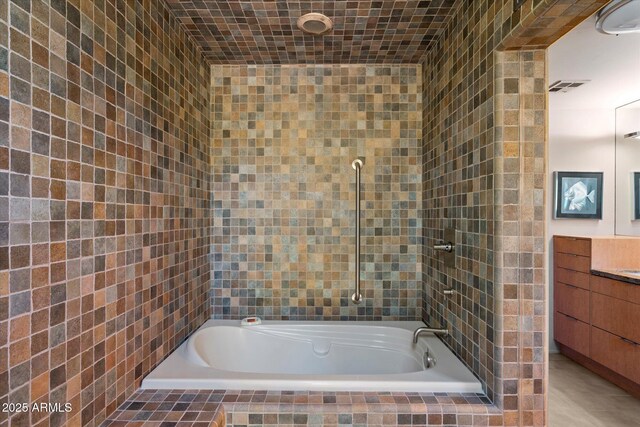 3120 Arroyo Hondo, Carefree, AZ 85377 - bathroom with vanity, tiled shower / bath combo, and visible vents