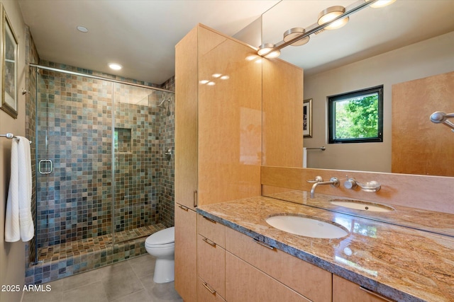 3120 Arroyo Hondo, Carefree, AZ 85377 - bathroom featuring a shower stall, tile patterned floors, vanity, and toilet