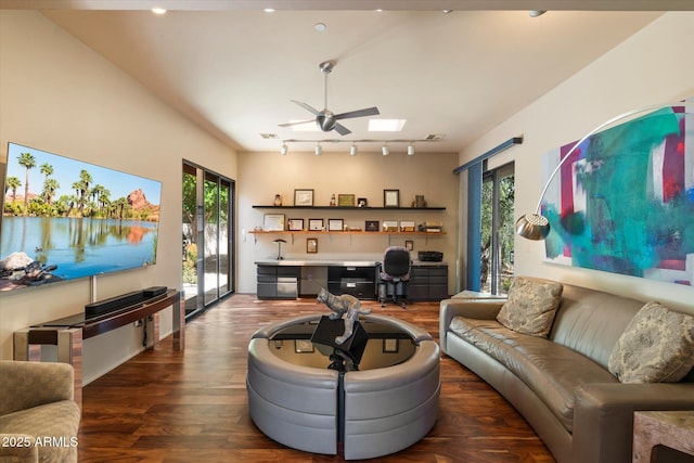 3120 Arroyo Hondo, Carefree, AZ 85377 - living area with rail lighting, a wealth of natural light, a ceiling fan, and wood finished floors