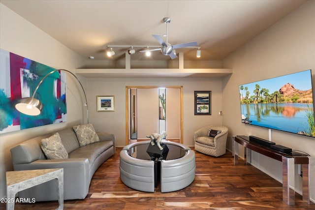 3120 Arroyo Hondo, Carefree, AZ 85377 - living room with vaulted ceiling, rail lighting, a ceiling fan, and wood finished floors