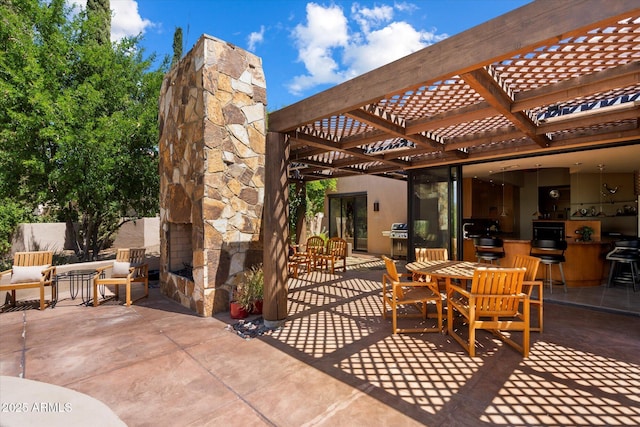 3120 Arroyo Hondo, Carefree, AZ 85377 - view of patio / terrace with a pergola, area for grilling, and an outdoor stone fireplace