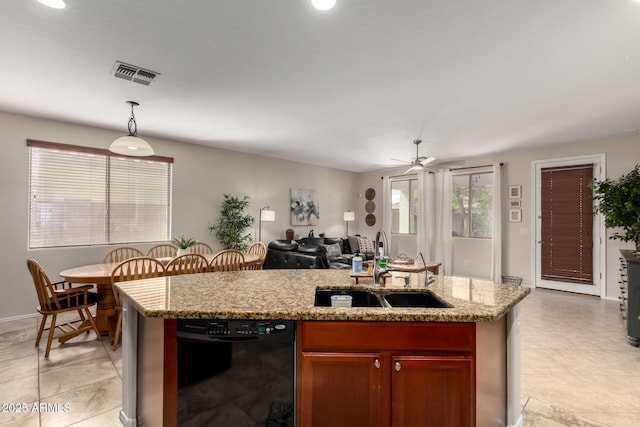 kitchen with visible vents, a sink, dishwasher, hanging light fixtures, and a kitchen island with sink