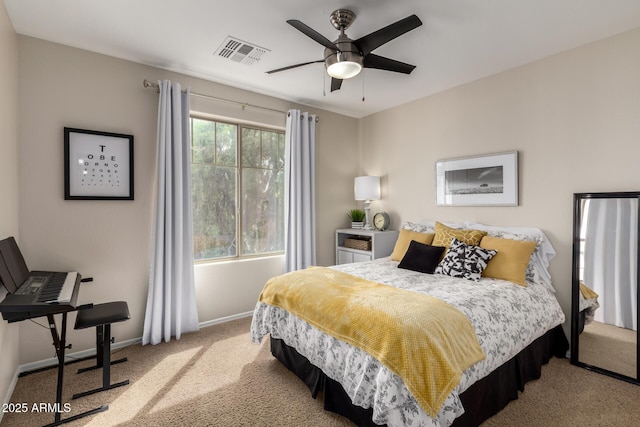 bedroom with a ceiling fan, carpet, visible vents, and baseboards