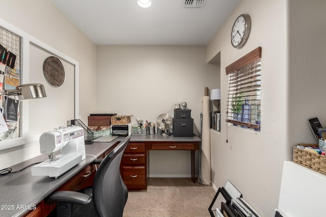 office featuring baseboards and visible vents