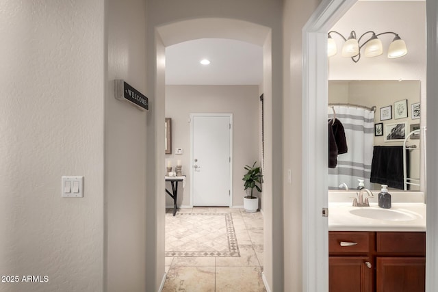 full bathroom with tile patterned floors and vanity