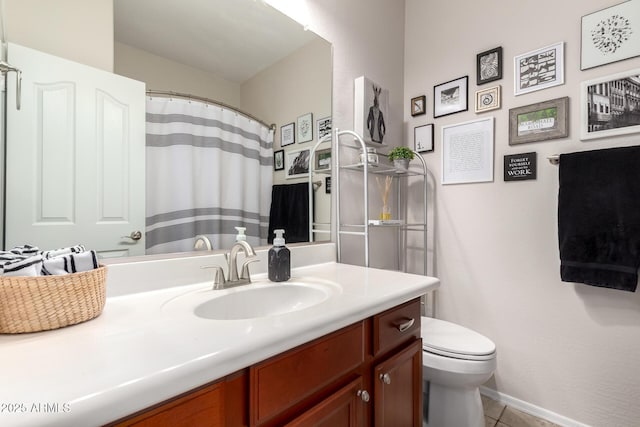 bathroom with baseboards, toilet, a shower with curtain, tile patterned floors, and vanity