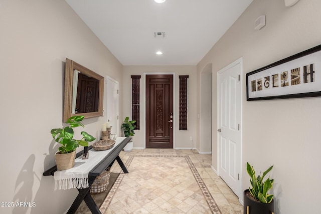 entrance foyer with recessed lighting, visible vents, and baseboards