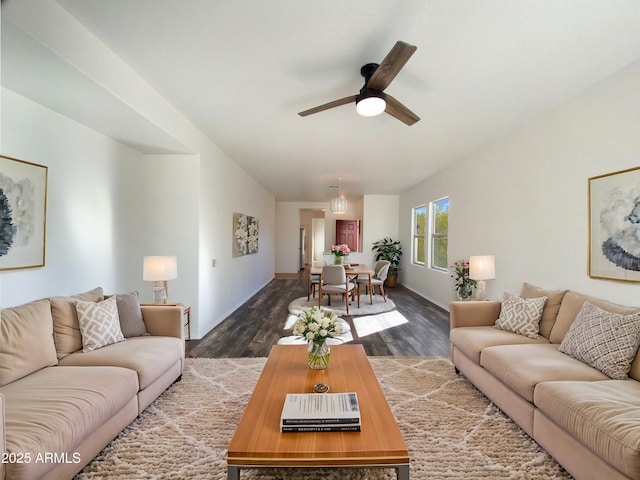 living room with ceiling fan and dark hardwood / wood-style floors