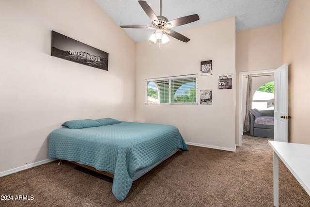 carpeted bedroom with a textured ceiling and ceiling fan